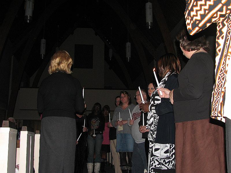 IMG_4487.JPG - Participants pledge to never let the light of those individuals who have died in anti-transgender violence go out, as they pass on the symbolic flame