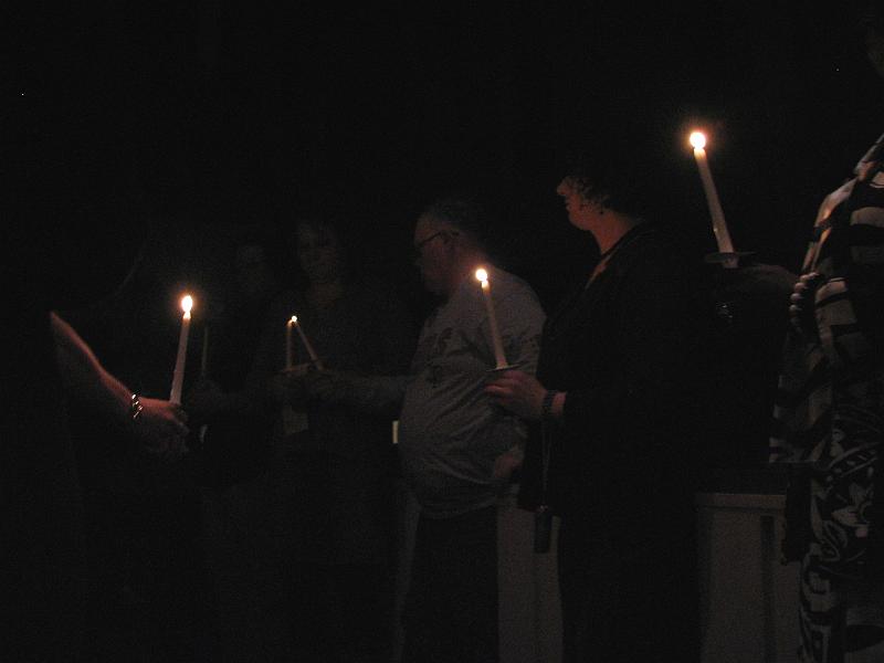 IMG_4489.JPG - Participants pledge to never let the light of those individuals who have died in anti-transgender violence go out, as they pass on the symbolic flame