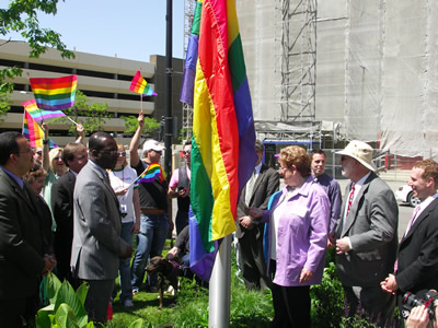 Madeline Davis raising flag at City Hall